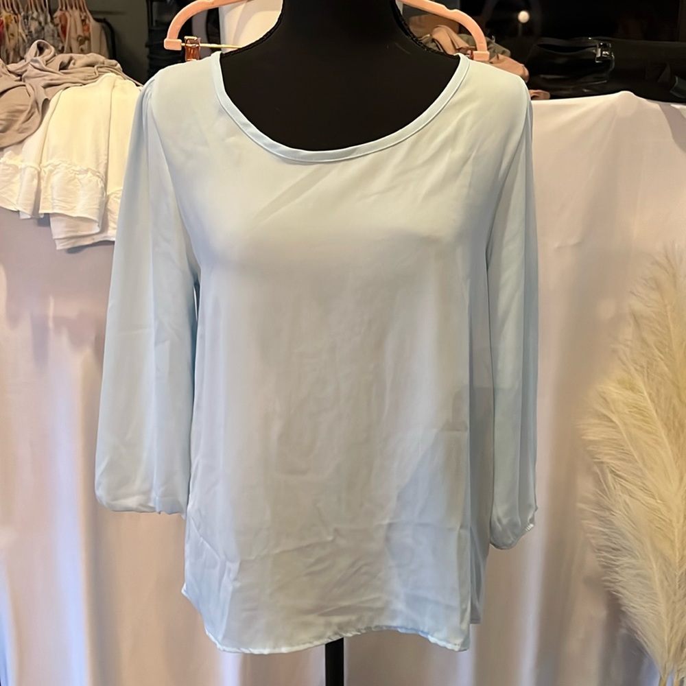 Baby blue long sleeve blouse with button back detail